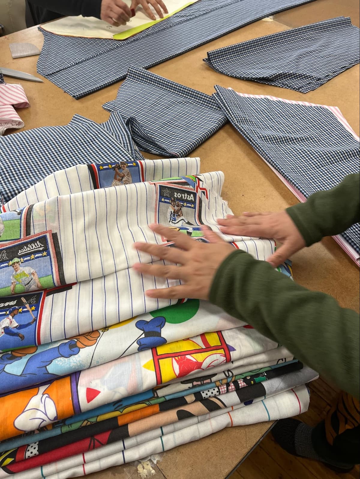 Dozens of baseball jerseys being repurposed at GOAT Vintage Hamilton's upcycling facility in Ontario, Canada.