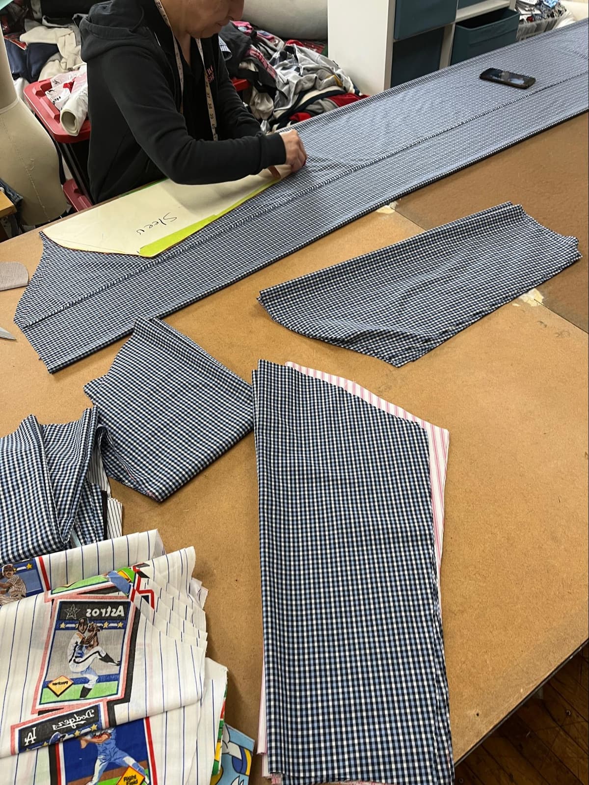 Fabric scraps meticulously organized for future upcycling projects at GOAT Vintage Hamilton, demonstrating their zero-waste approach.